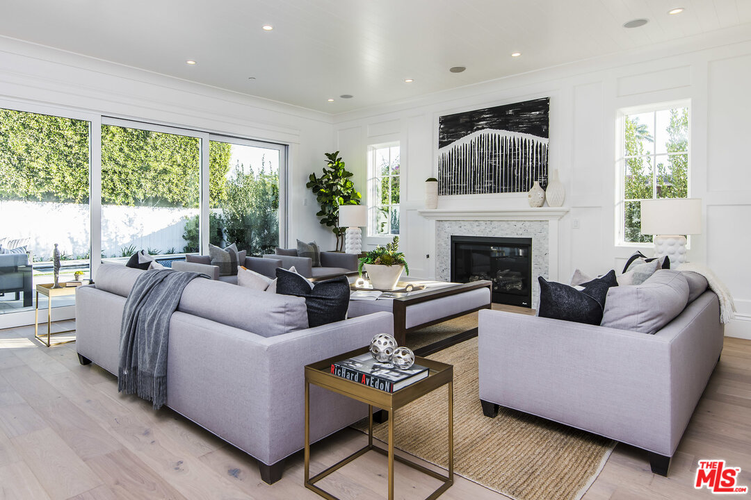 107 Larkin Place Santa Monica, CA 90402 - Photo 22 of 51 a living room with furniture fireplace and a large window