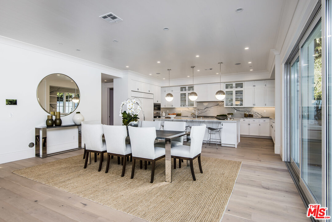 107 Larkin Place Santa Monica, CA 90402 - Photo 25 of 51 a living room with stainless steel appliances kitchen island granite countertop furniture and a dining table