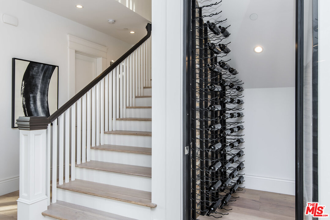107 Larkin Place Santa Monica, CA 90402 - Photo 27 of 51 a view of a hallway with wooden floor and stairs