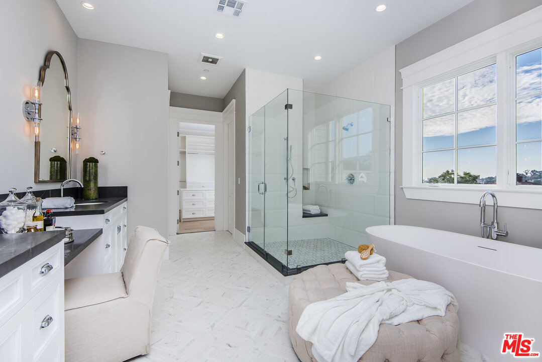 107 Larkin Place Santa Monica, CA 90402 - Photo 32 of 51 a bathroom with a tub sink mirror and shower