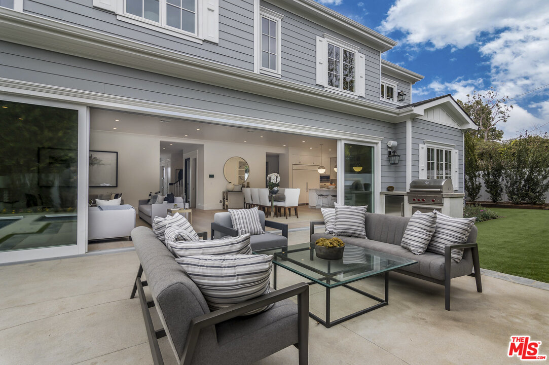 107 Larkin Place Santa Monica, CA 90402 - Photo 6 of 51 a view of a patio with couches table and chairs and potted plants