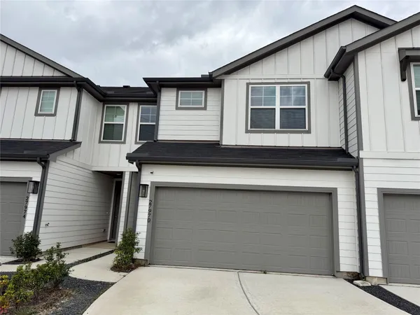 a front view of a house with a garage