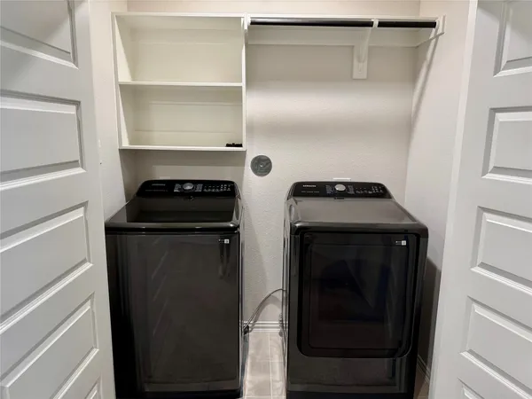 a kitchen with a refrigerator and a stove