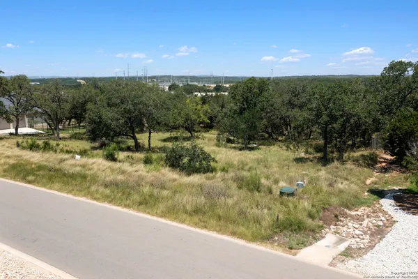 a view of a yard next to a building