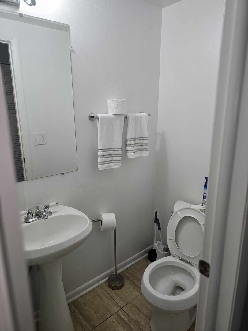 877 Wellington Avenue, Unit 1 Elk Grove Village, IL 60007 - Photo 17 of 25 a bathroom with a toilet sink and mirror