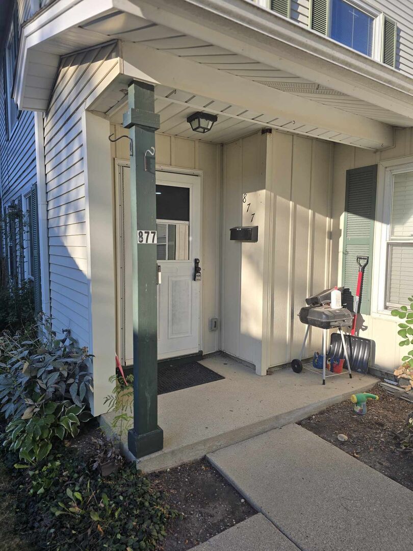 877 Wellington Avenue, Unit 1 Elk Grove Village, IL 60007 - Photo 2 of 25 a view of a entryway door of the house