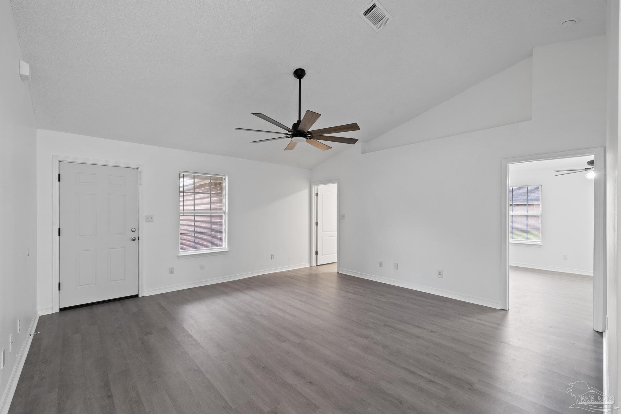 5564 Paddle Wheel Drive Milton, FL 32583 - Photo 12 of 41 a view of empty room with wooden floor