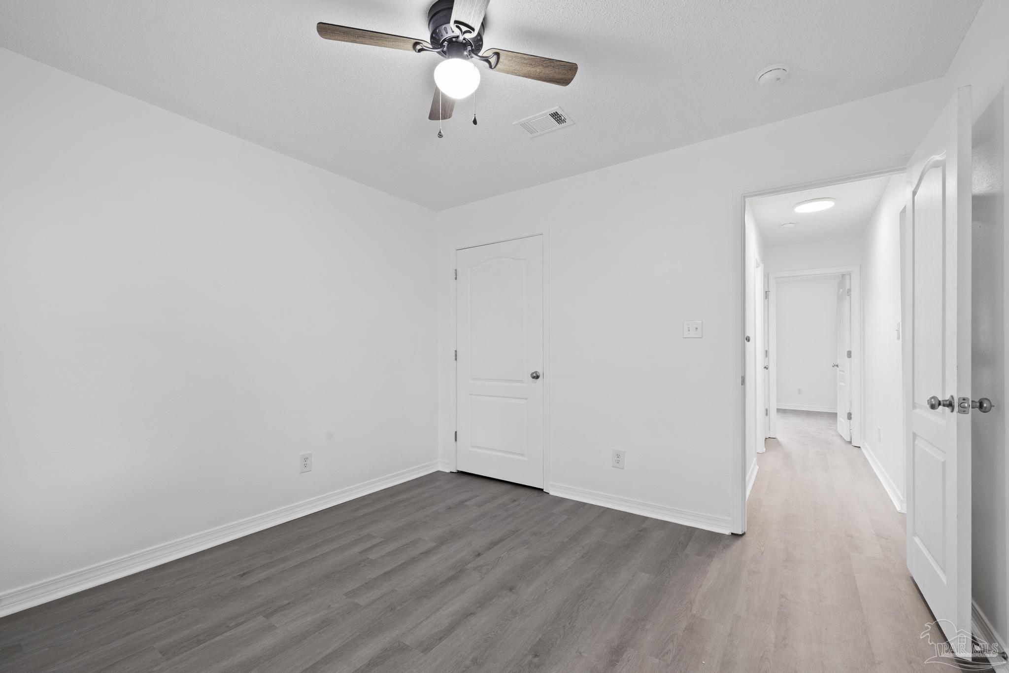 5564 Paddle Wheel Drive Milton, FL 32583 - Photo 19 of 41 wooden floor in an empty room