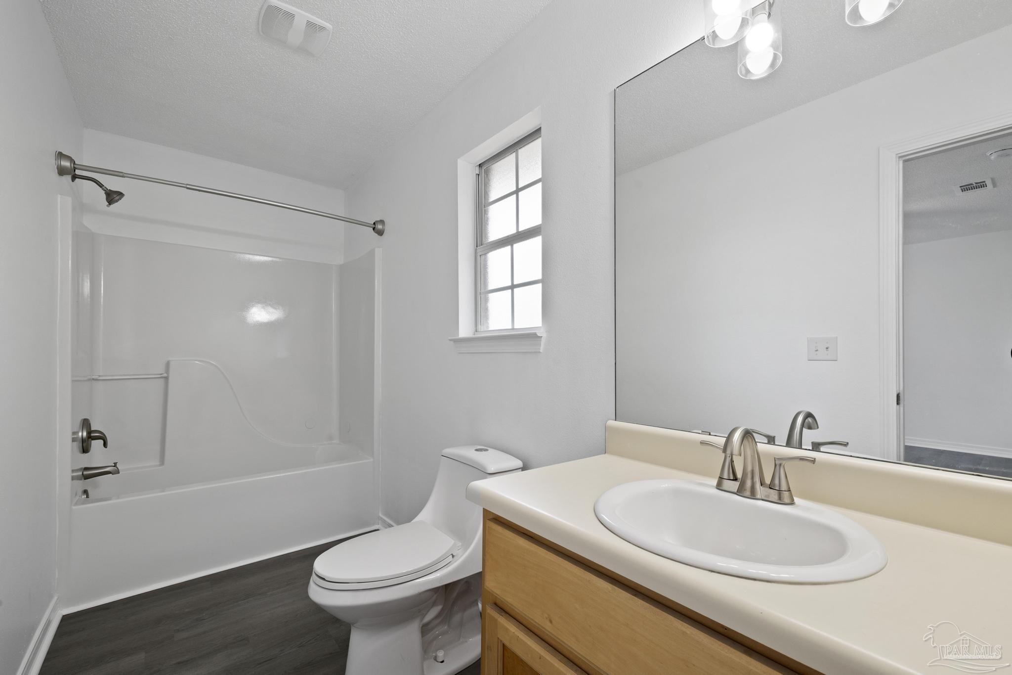 5564 Paddle Wheel Drive Milton, FL 32583 - Photo 27 of 41 a bathroom with a sink a toilet and shower