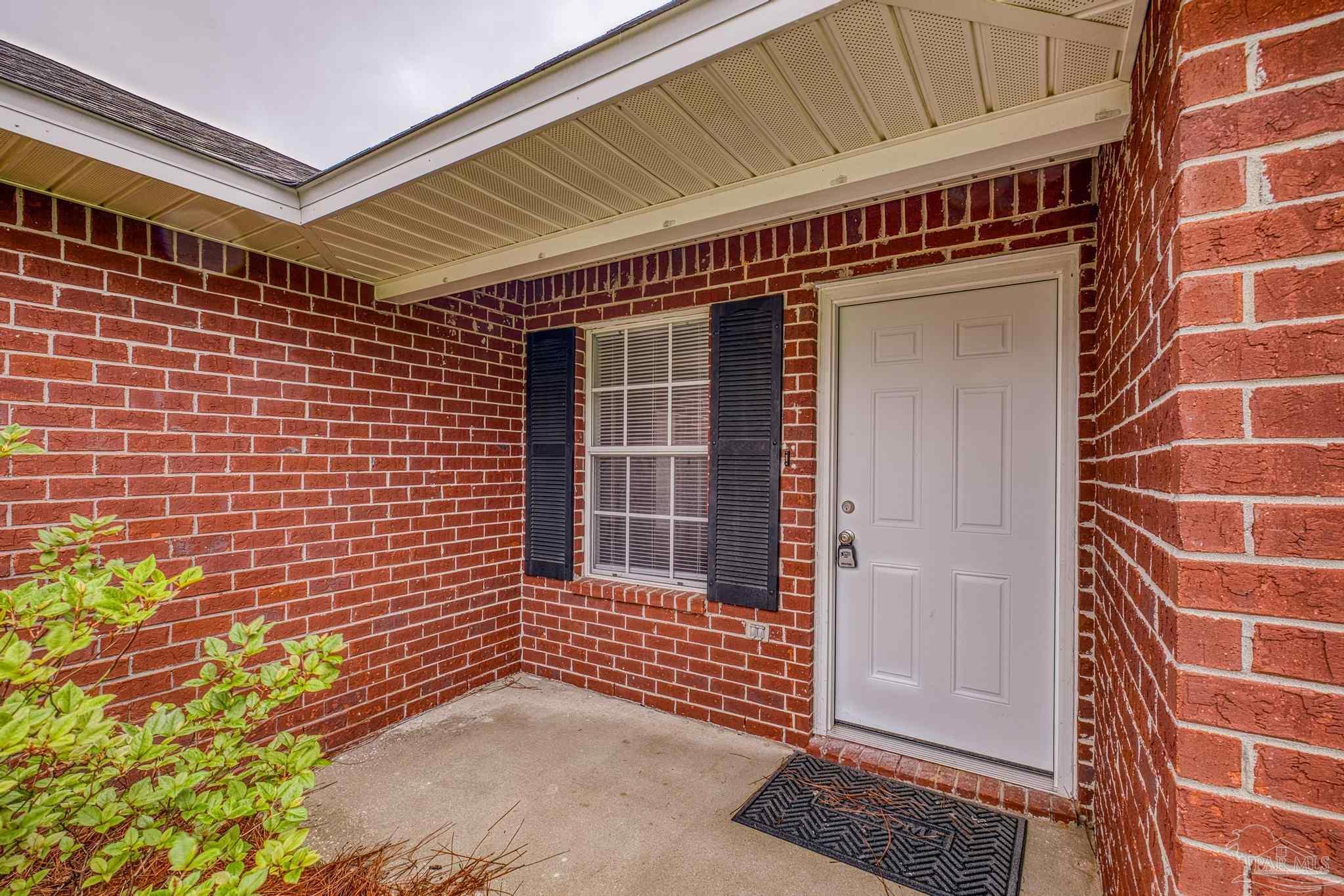 5564 Paddle Wheel Drive Milton, FL 32583 - Photo 3 of 41 a view of a door with a door