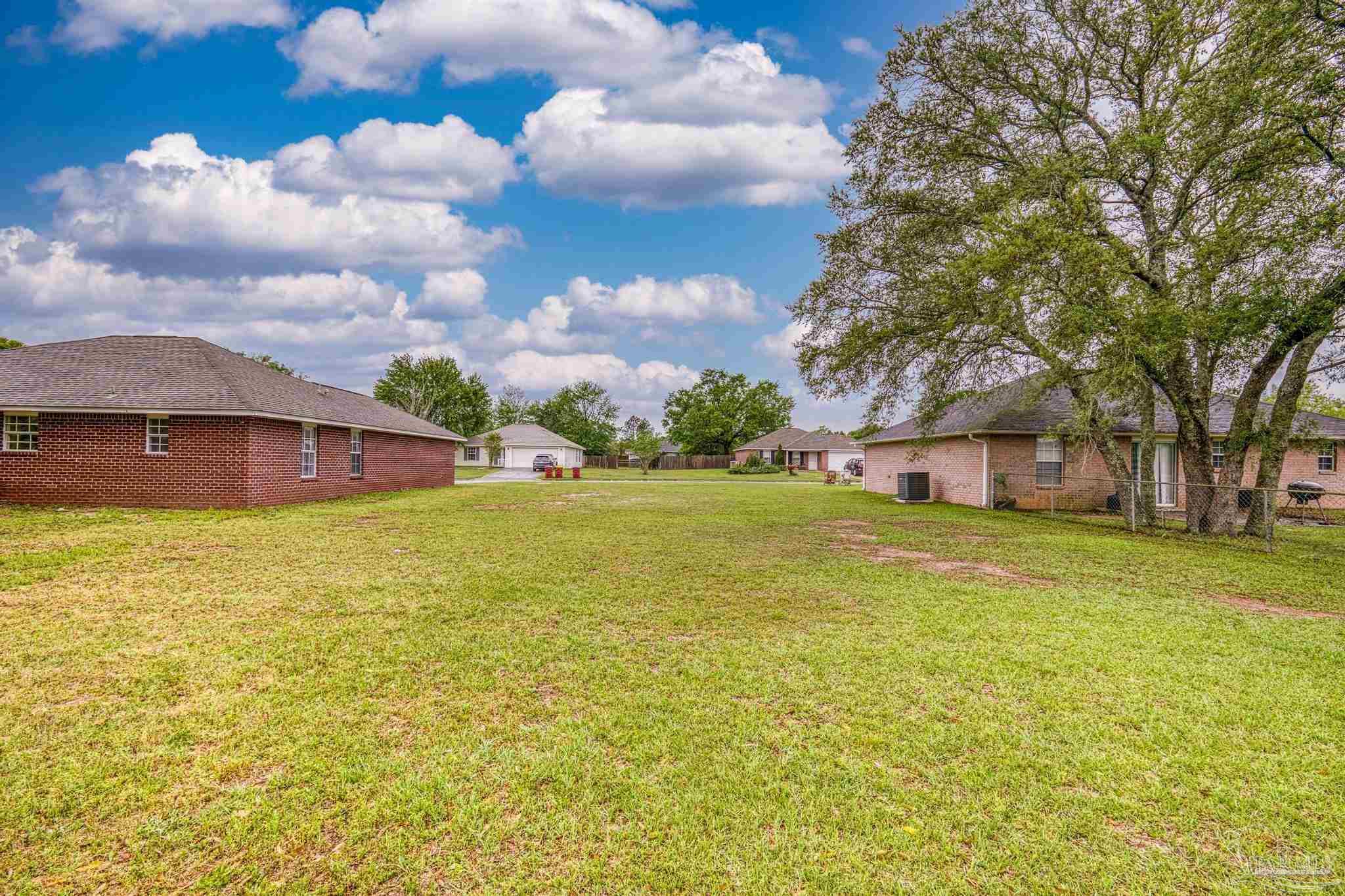 5564 Paddle Wheel Drive Milton, FL 32583 - Photo 31 of 41 a front view of house with yard