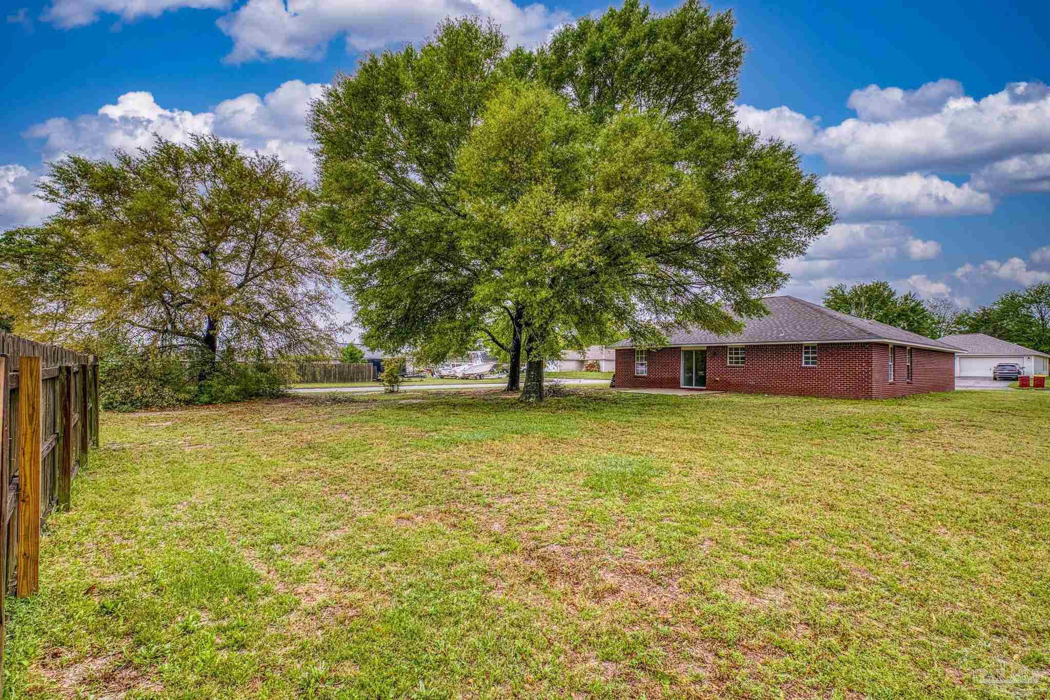 5564 Paddle Wheel Drive Milton, FL 32583 - Photo 32 of 41 a tree in the garden view