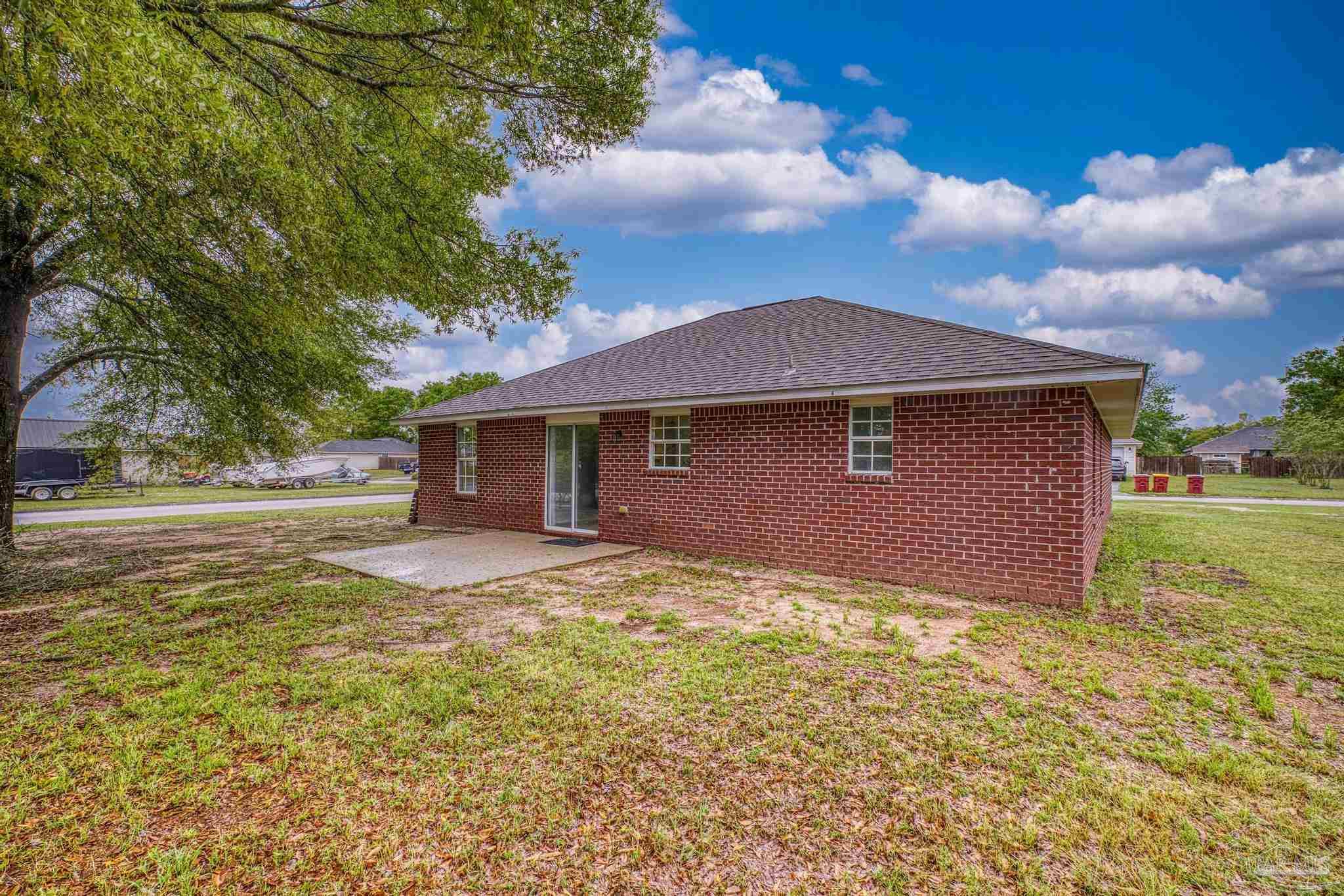 5564 Paddle Wheel Drive Milton, FL 32583 - Photo 33 of 41 a view of a house with a yard