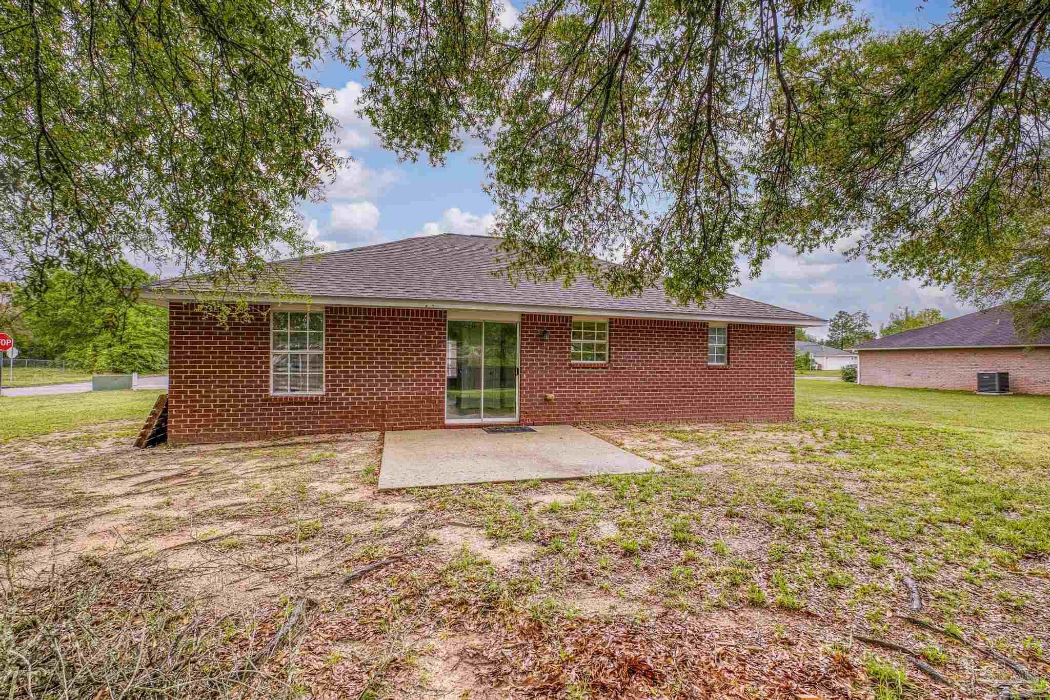 5564 Paddle Wheel Drive Milton, FL 32583 - Photo 35 of 41 a house that has a tree in front of it