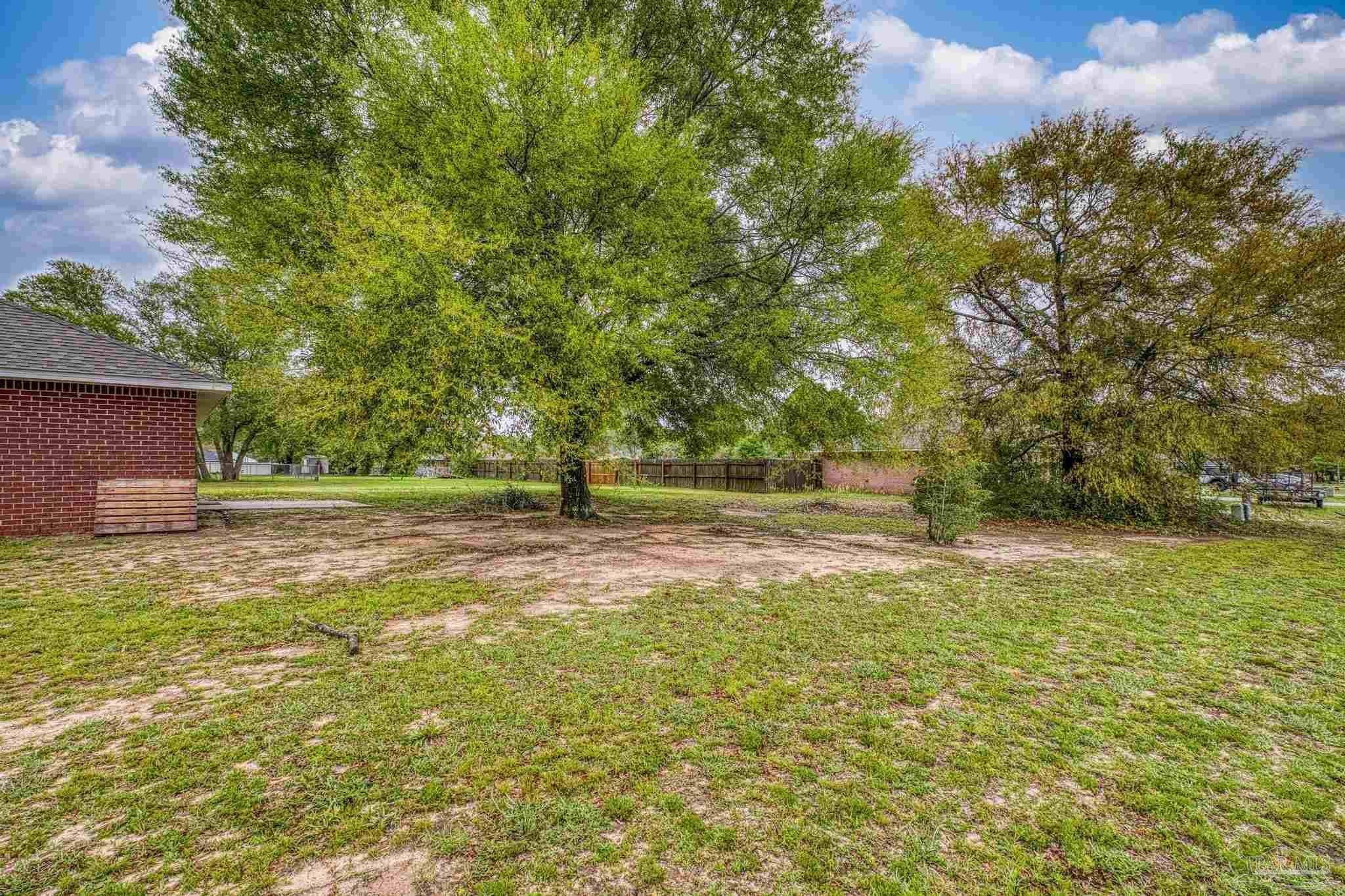 5564 Paddle Wheel Drive Milton, FL 32583 - Photo 37 of 41 a view of a yard with a house