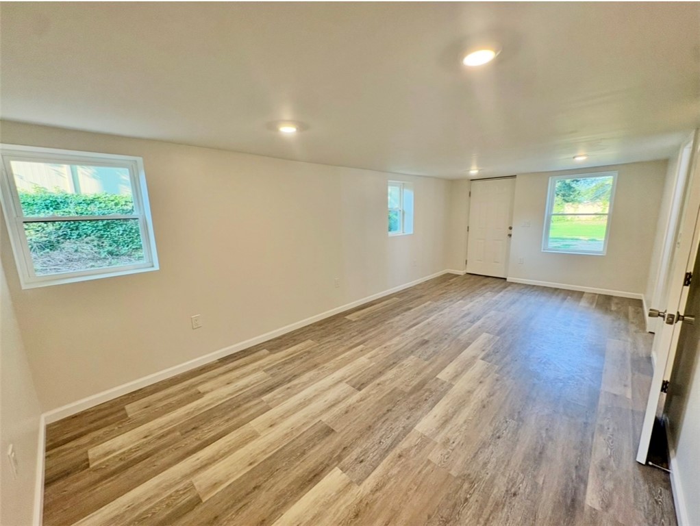 1904 East Calhoun Street Anderson, SC 29621 - Photo 22 of 36 A spacious room offers ample natural light and durable, wood-look flooring.