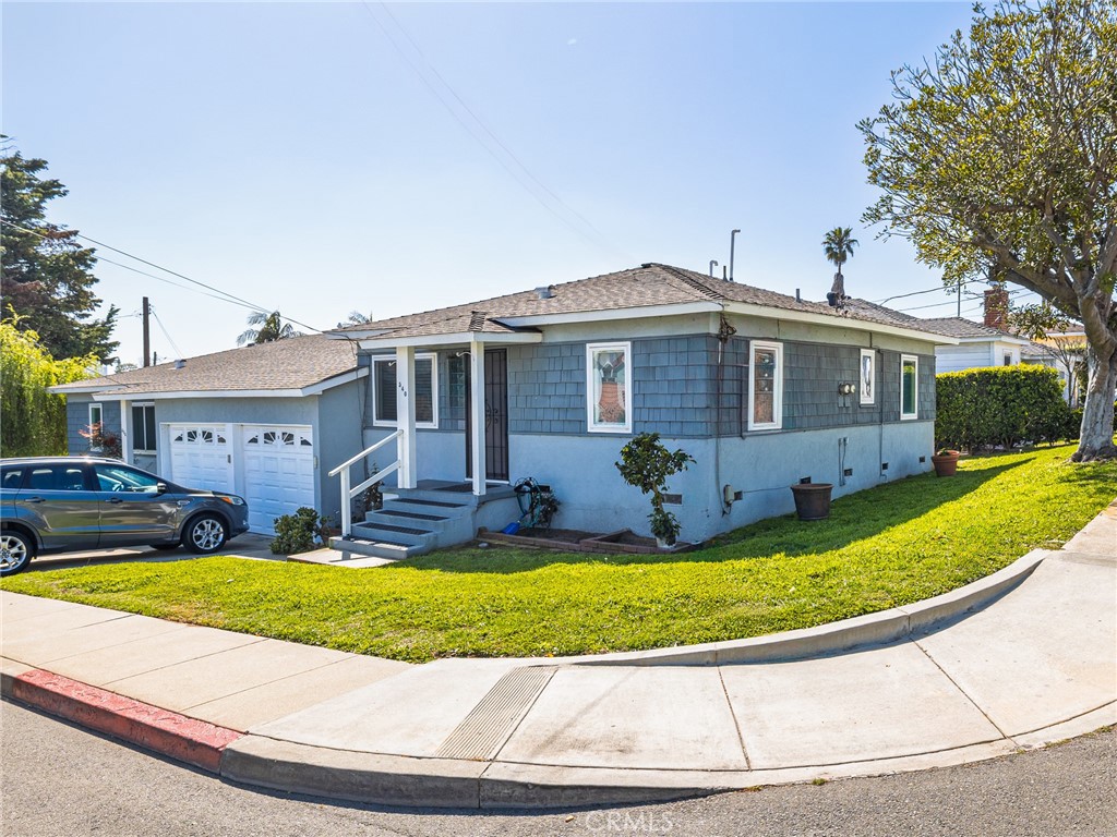 536 West Maple Avenue El Segundo, CA 90245 - Photo 1 of 3 a front view of house with yard and swimming pool