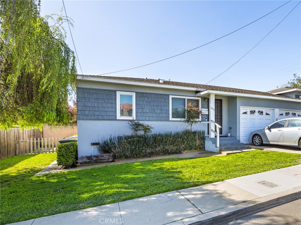 536 West Maple Avenue El Segundo, CA 90245 - Photo 2 of 3 a front view of house with yard and green space