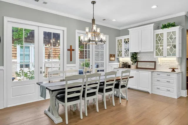 a bathroom with a granite countertop sink a toilet and a mirror