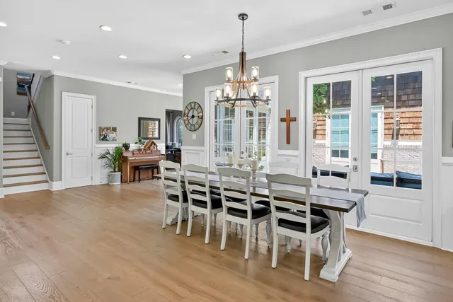 a front view of a house with a garden and patio