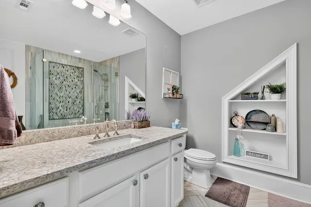 a kitchen with stainless steel appliances granite countertop a refrigerator and a stove