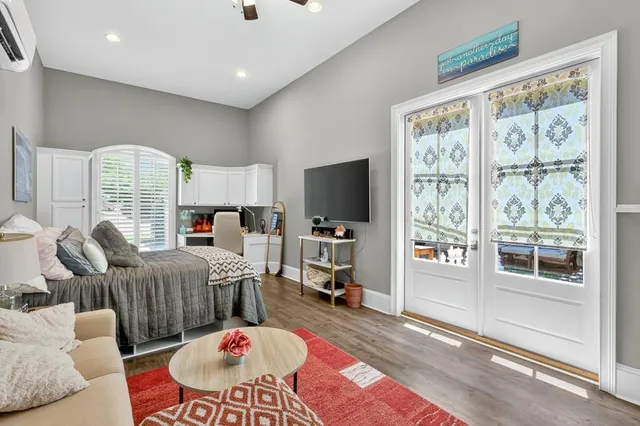 a kitchen with appliances a sink and cabinets