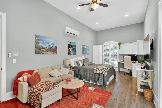 a bedroom with a bed and a dresser in it