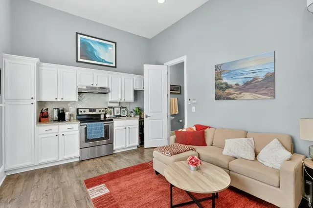 a room that has a bed and a table in it