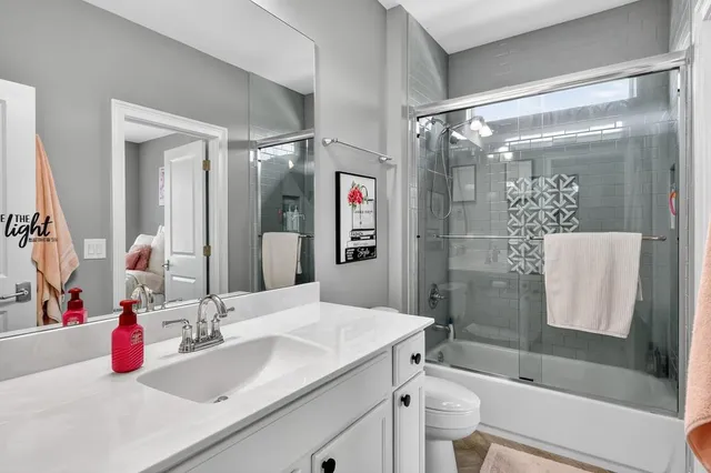 a bed room with furniture and a flat screen tv