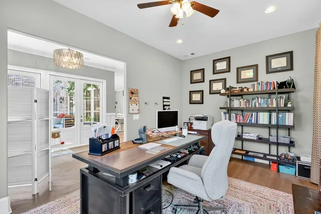 a kitchen with stainless steel appliances granite countertop a sink a stove and a refrigerator