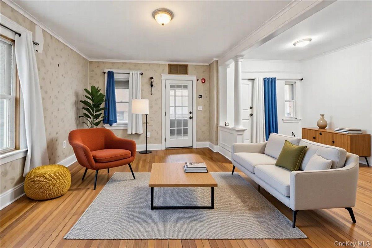 59 Jackson Street New Rochelle, NY 10801 - Photo 2 of 15 a living room with furniture and a chair