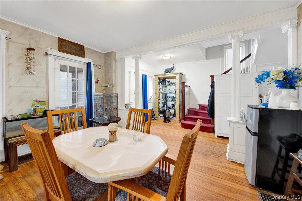 59 Jackson Street New Rochelle, NY 10801 - Photo 4 of 15 a view of a dining room with furniture and wooden floor