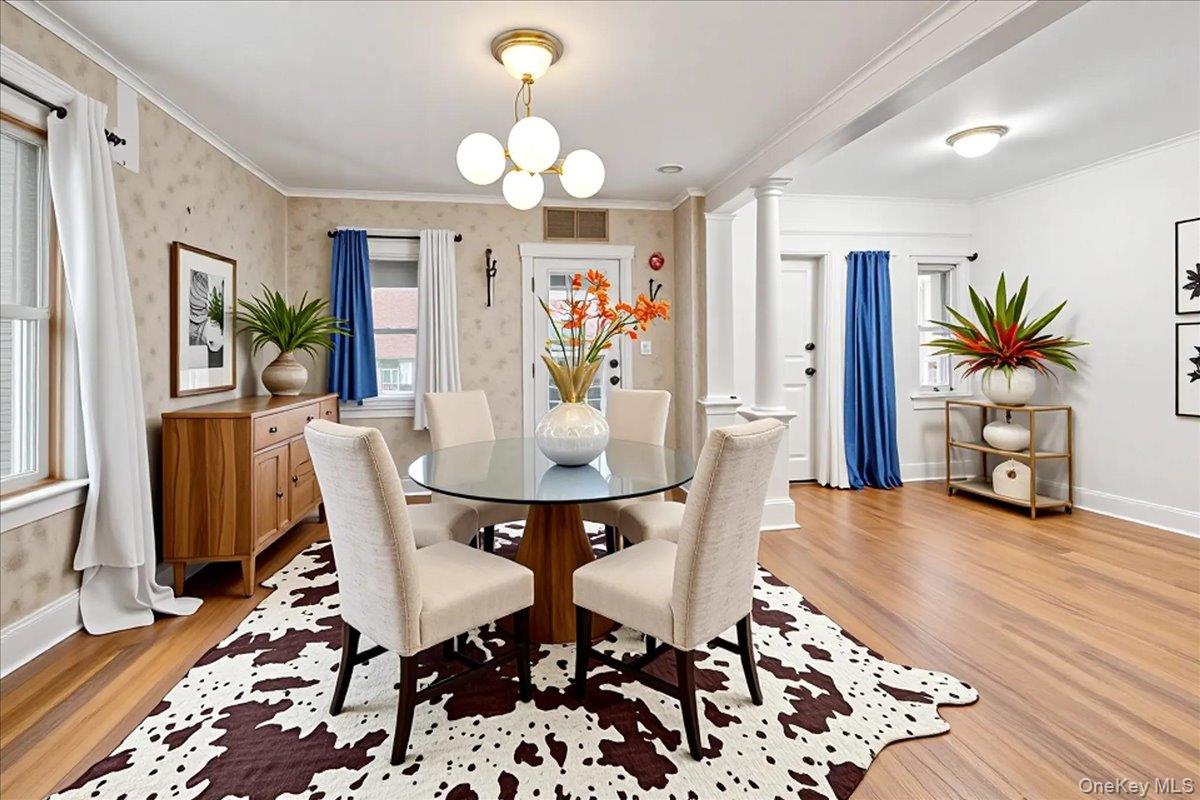 59 Jackson Street New Rochelle, NY 10801 - Photo 5 of 15 a view of a dining room with furniture and wooden floor