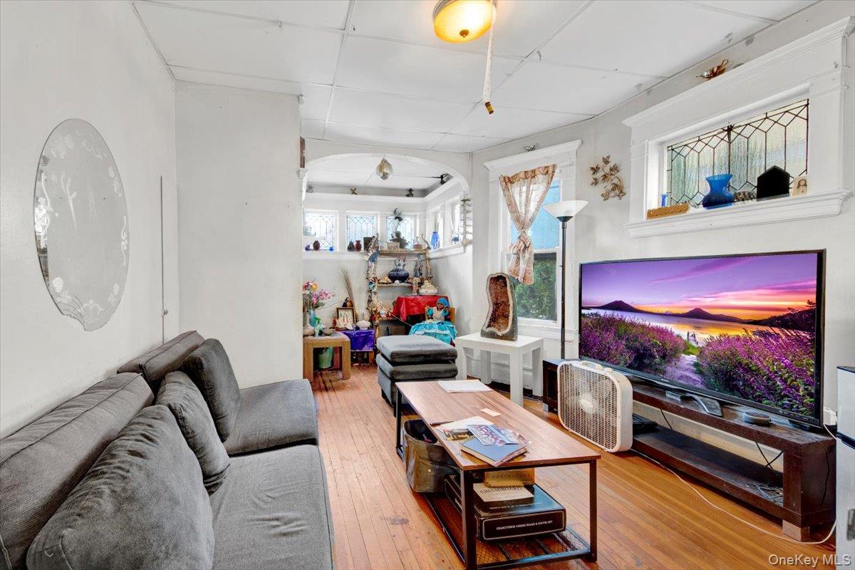 59 Jackson Street New Rochelle, NY 10801 - Photo 10 of 15 a living room with furniture and a flat screen tv