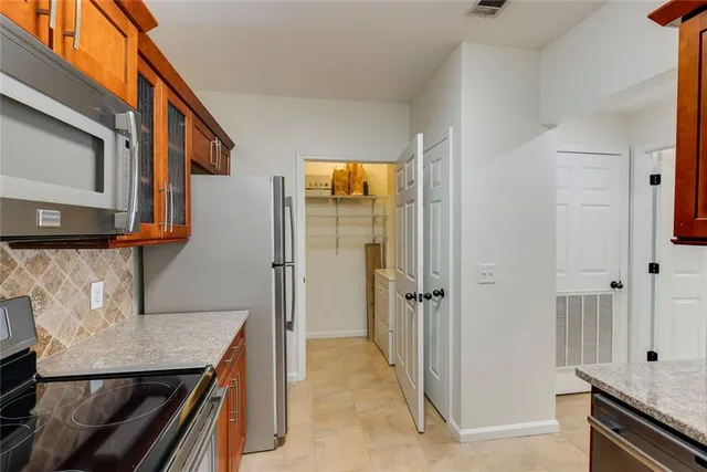 a view of a kitchen from the hallway