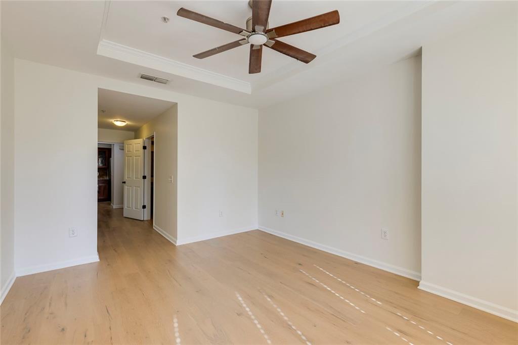 Undisclosed Address Atlanta, GA 30326 - Photo 20 of 38 an empty room with fan and a ceiling fan