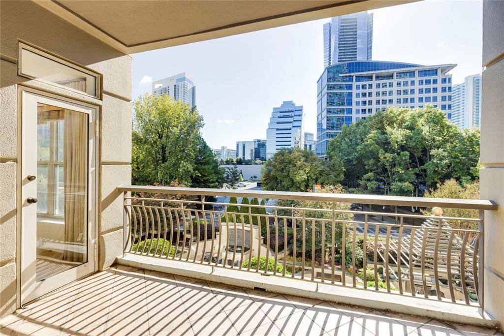 Undisclosed Address Atlanta, GA 30326 - Photo 22 of 38 a view of balcony with a large window and wooden floor