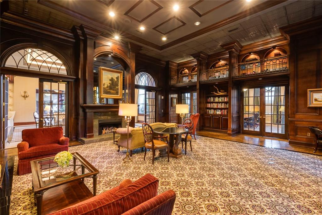 Undisclosed Address Atlanta, GA 30326 - Photo 26 of 38 a living room with furniture a fireplace and large windows