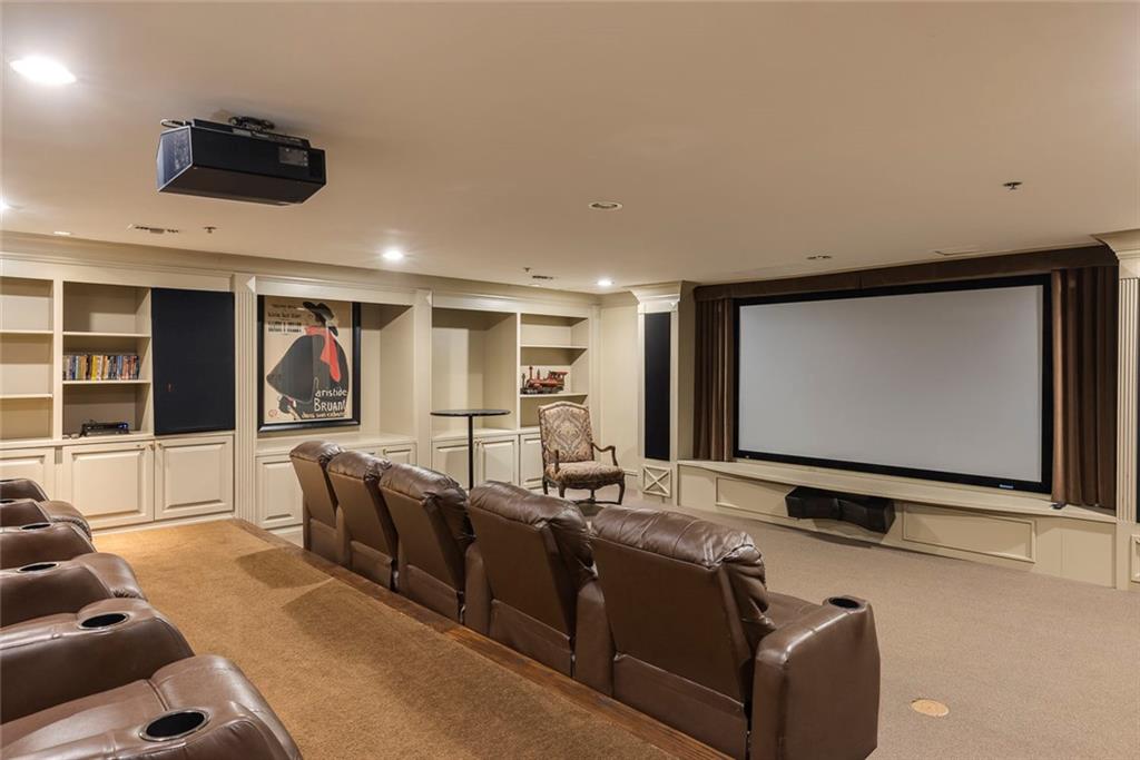 Undisclosed Address Atlanta, GA 30326 - Photo 29 of 38 a living room with furniture flat screen tv and floor to ceiling window