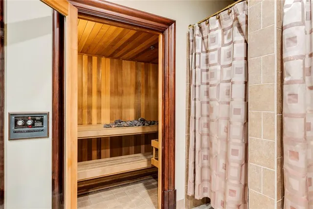 a view of a swimming pool with sitting area and garden