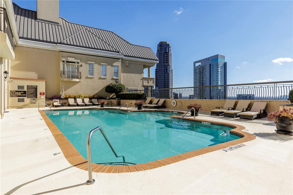 Undisclosed Address Atlanta, GA 30326 - Photo 37 of 38 a view of a swimming pool with chairs
