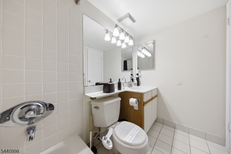 609 Mark Twain Way Mahwah, NJ 07430 - Photo 17 of 40 a bathroom with a sink a toilet and mirror