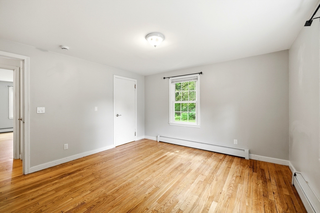 130 Connecticut Avenue Springfield, MA 01107 - Photo 30 of 40 an empty room with wooden floor and windows