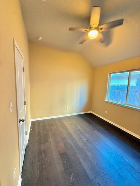 918 Silo Street San Marcos, TX 78666 - Photo 22 of 24 a view of an empty room with wooden floor and a window
