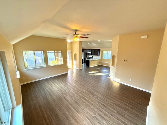 918 Silo Street San Marcos, TX 78666 - Photo 8 of 24 a view of empty room with wooden floor and fireplace
