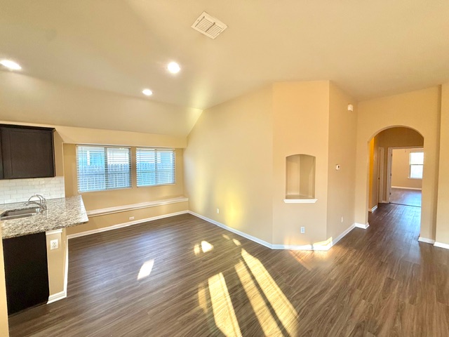 918 Silo Street San Marcos, TX 78666 - Photo 9 of 24 a view of livingroom with kitchen and wooden floor