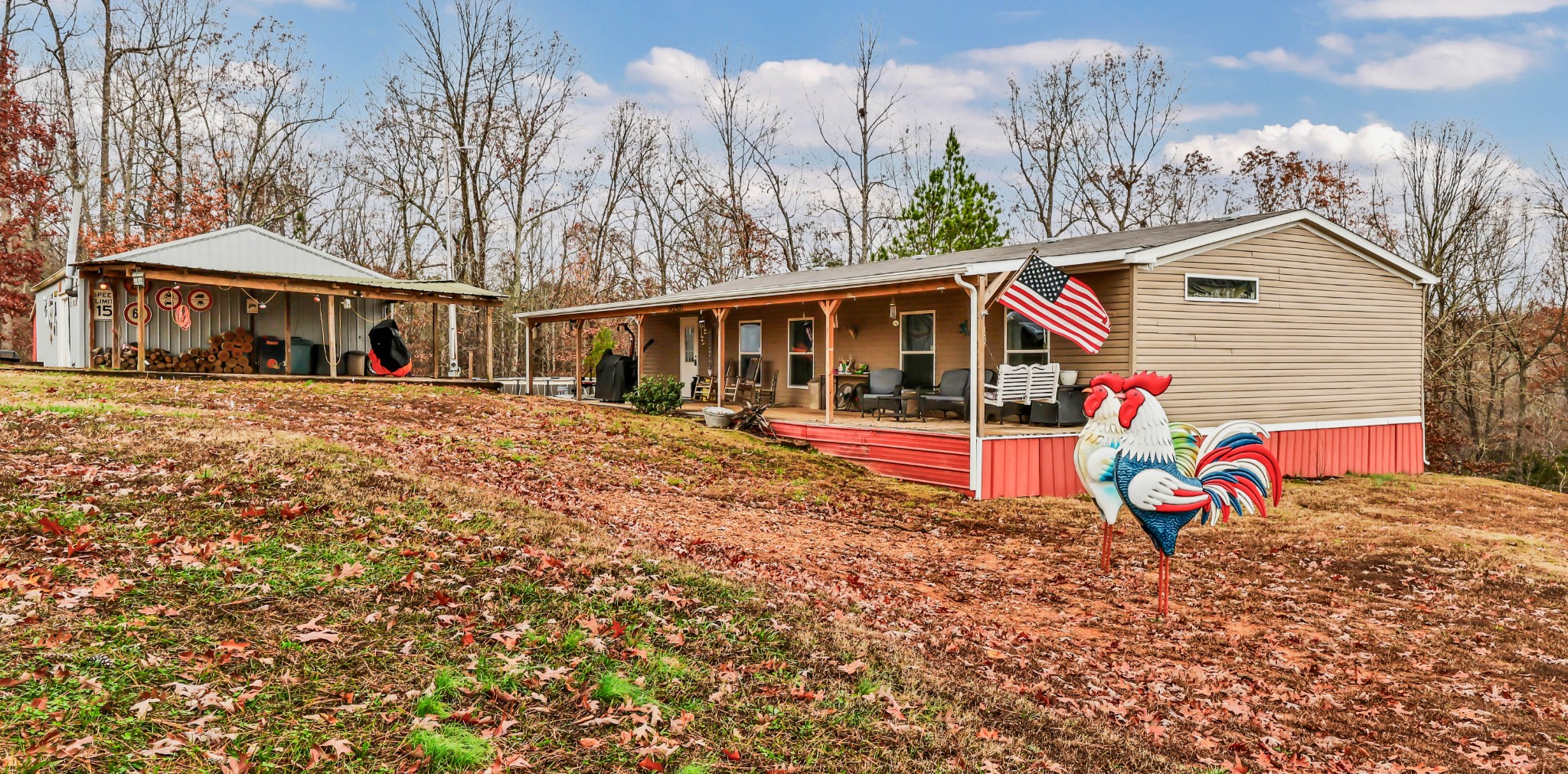 124 Old Lafayette Road Big Rock, TN 37023 - Photo 24 of 62 a view of a house with large trees and lawn chairs