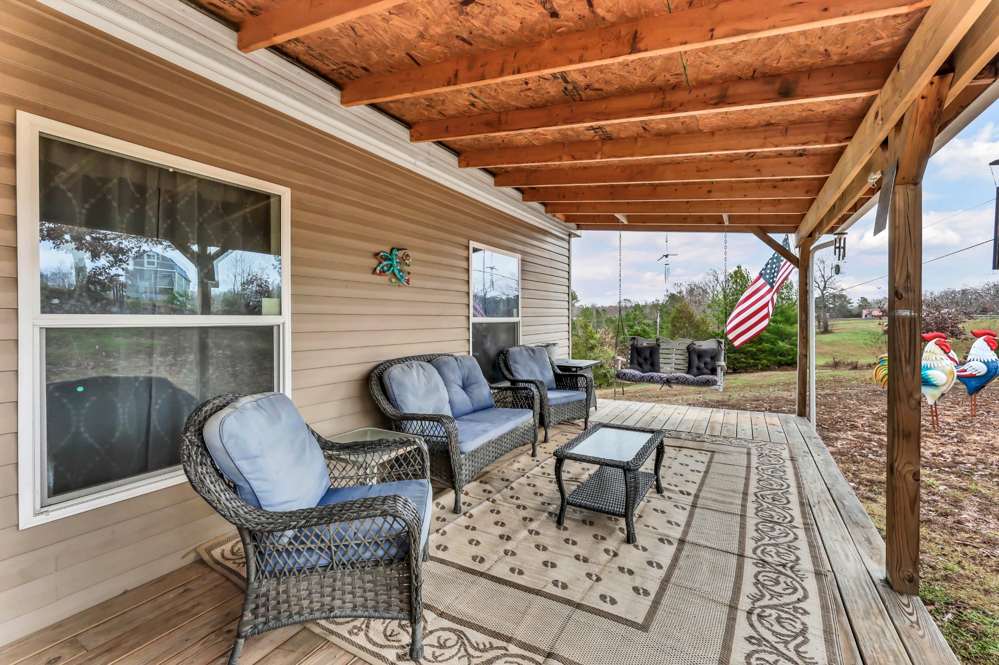 124 Old Lafayette Road Big Rock, TN 37023 - Photo 27 of 62 a patio with table and chairs and potted plants