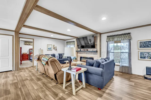 a kitchen with stainless steel appliances granite countertop a sink and a white cabinets