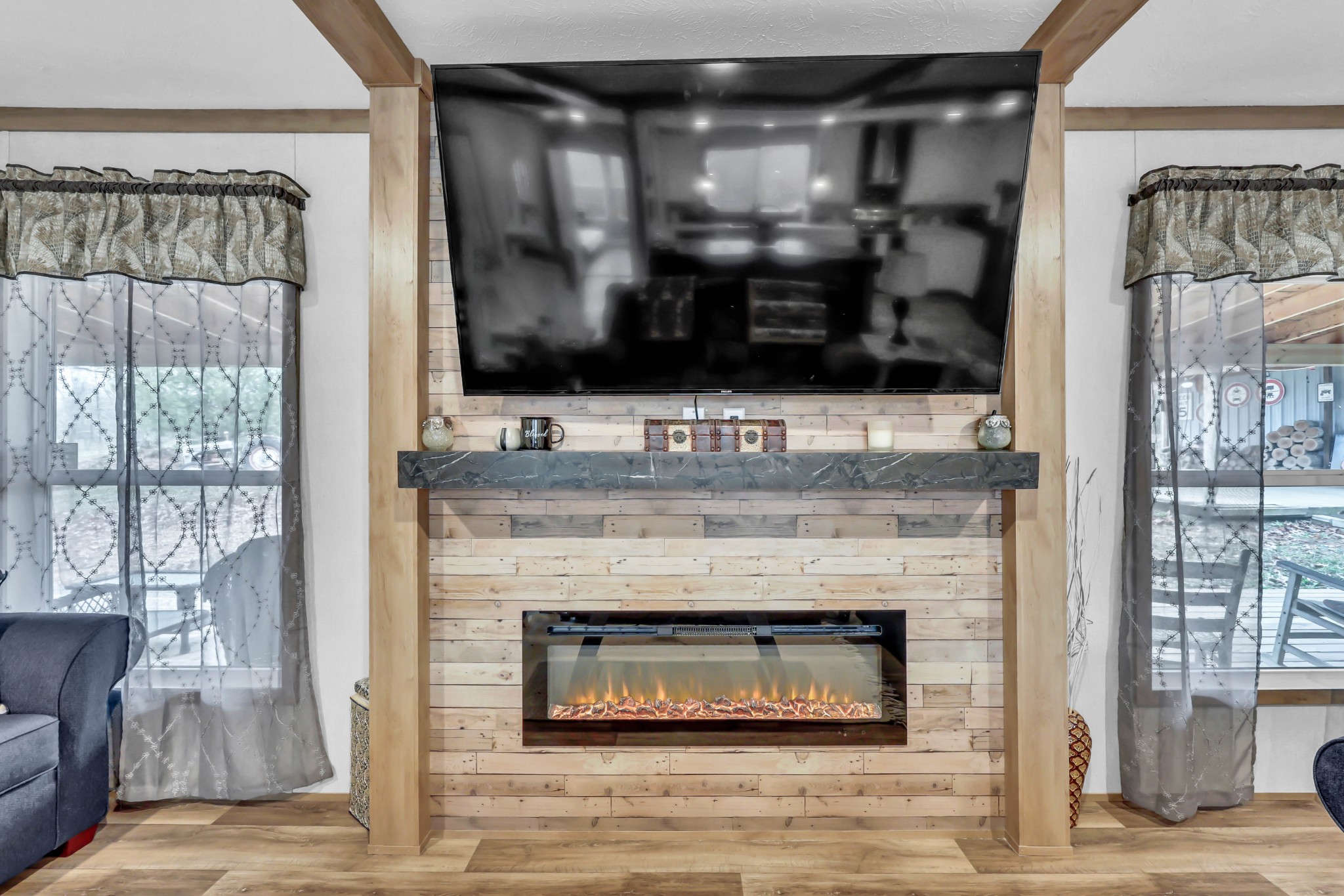 124 Old Lafayette Road Big Rock, TN 37023 - Photo 33 of 62 a living room with a fireplace and a flat screen tv